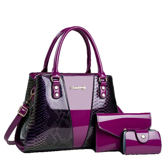 Purple handbag with matching wallet on a white background