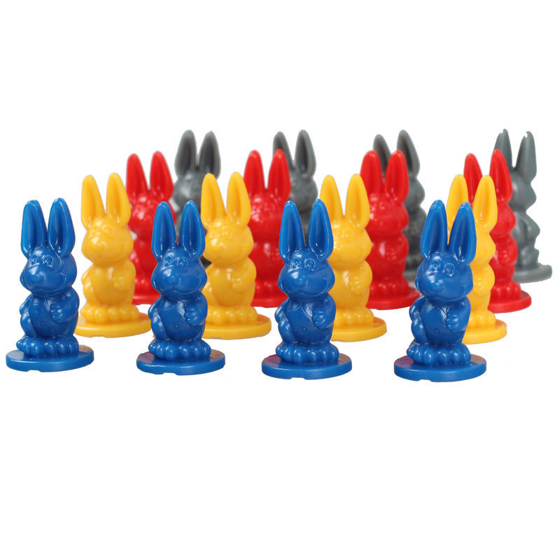 Colorful rabbit-shaped game pieces on a white background