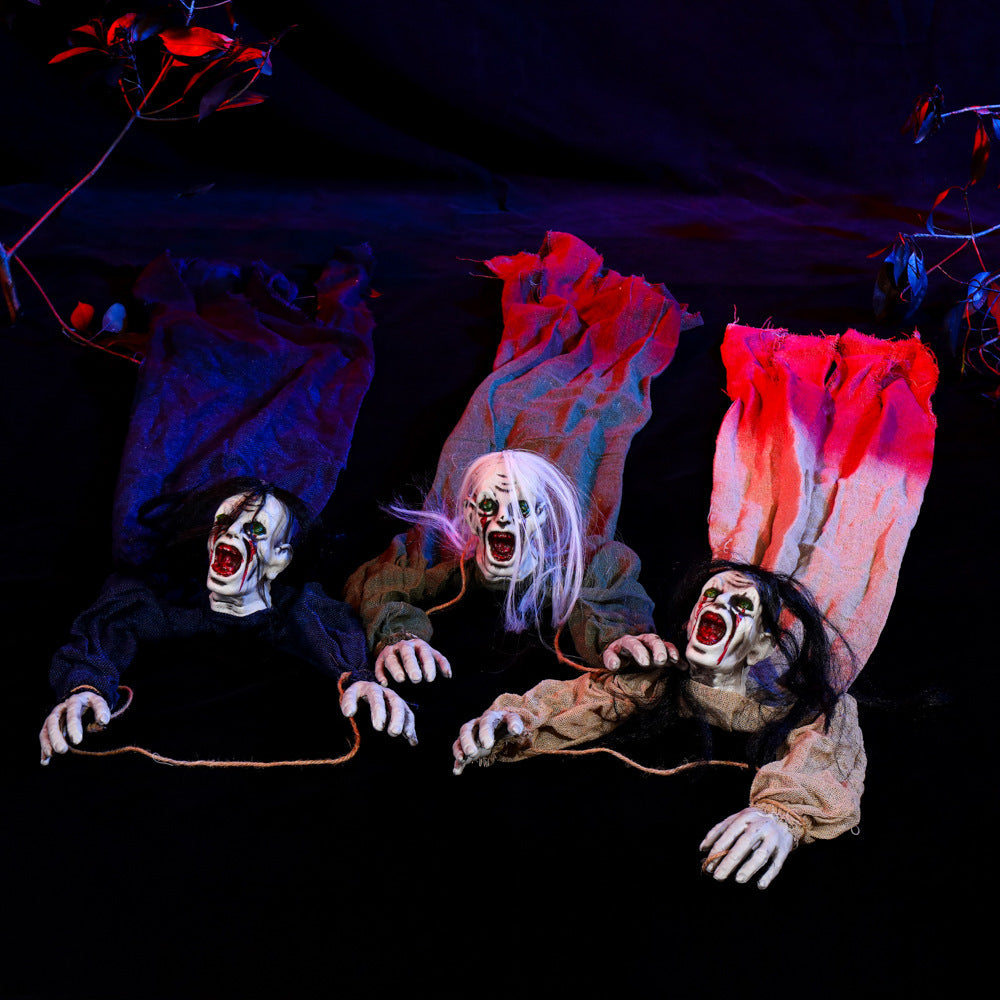 Horror-themed decorations with masked figures and red flames on a dark background
