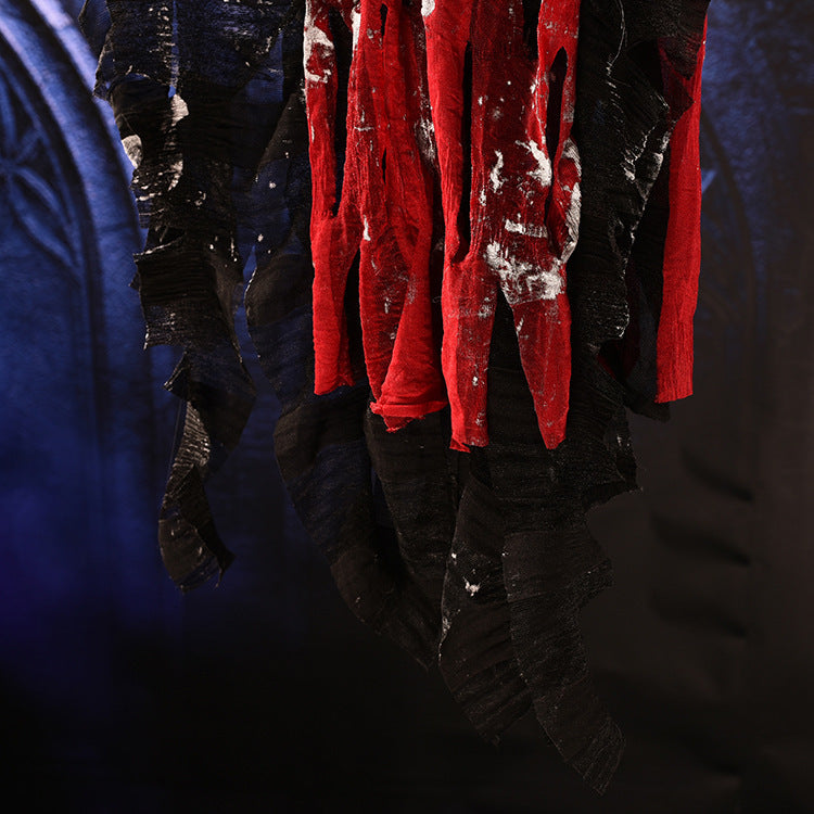Red garment with white stains on a dark background