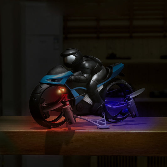 Toy motorcycle with helmet on a wooden surface in a dark setting