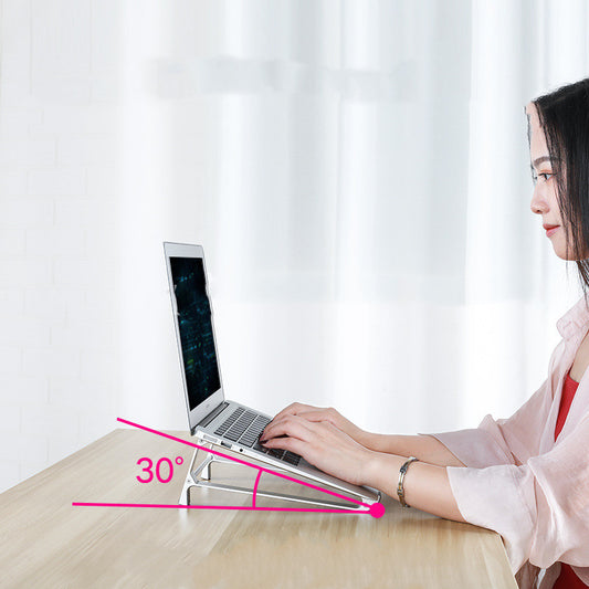 Woman using a laptop with a 30-degree angle indicated on a white background