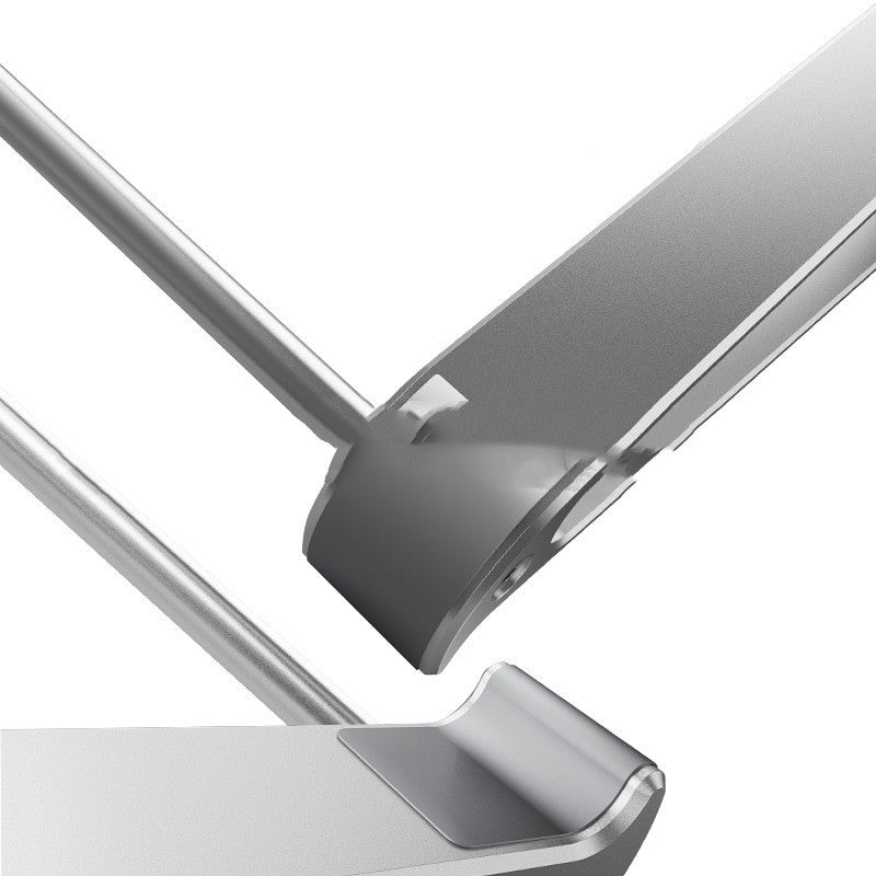 Close-up of a metallic object with a reflective surface on a white background