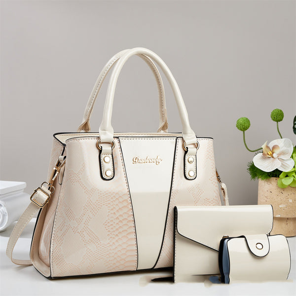 Beige handbag with matching wallet on a light gray background