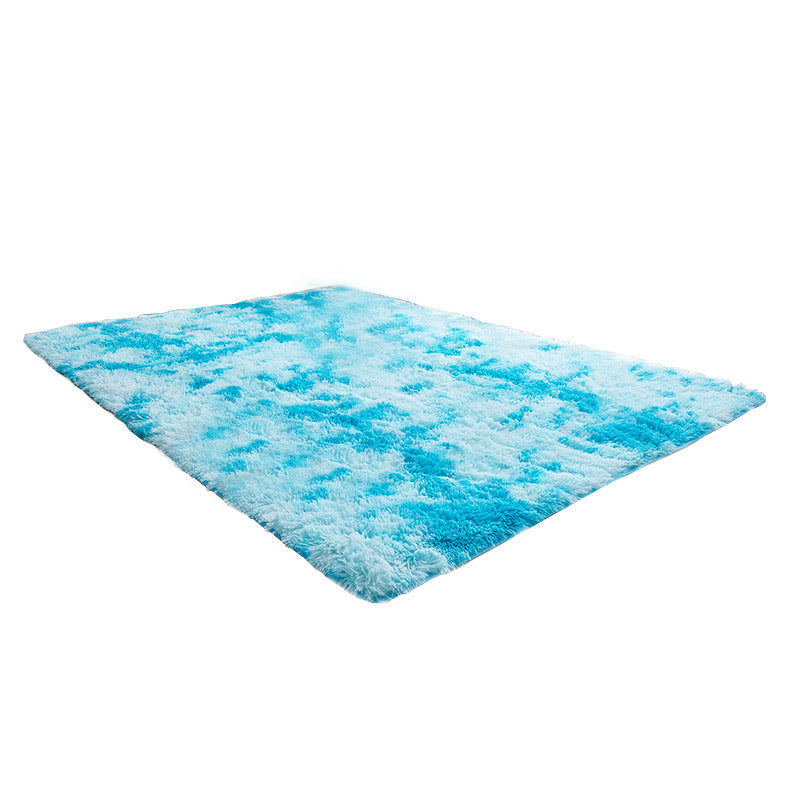 Blue and white textured rug on a white background