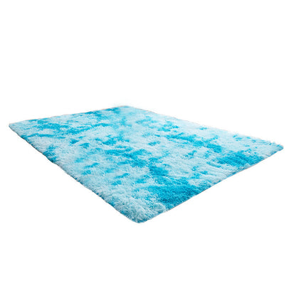 Blue and white textured rug on a white background