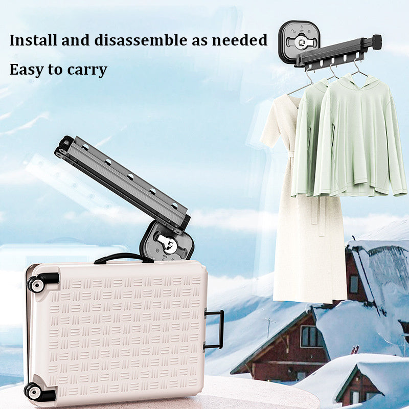 Portable clothesline with a suitcase on a snowy background