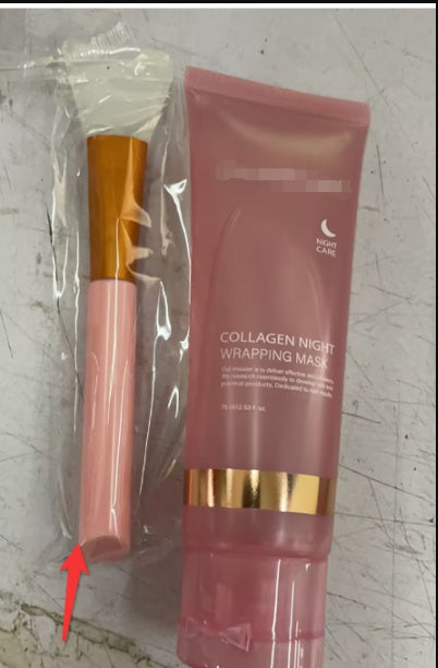 Collagen night wrapping mask and brush on a textured surface
