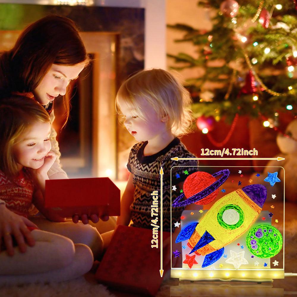 Children and a woman looking at a colorful LED light-up toy with a rocket design, Christmas tree in the background.