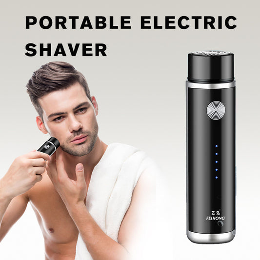 Man using a portable electric shaver with a black shaver and charging case on a light gray background.