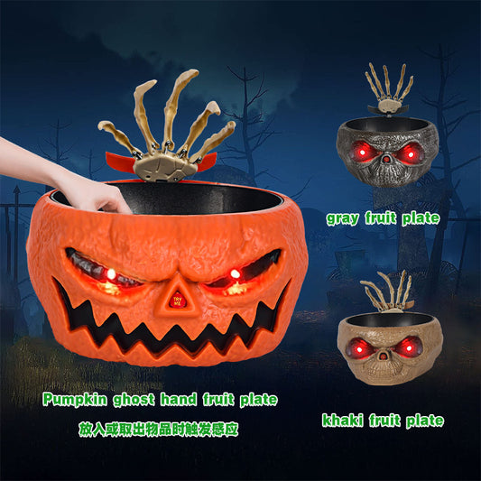 Halloween-themed fruit plates with glowing eyes against a dark background
