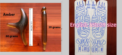 Two wooden tools with measurements and a chart on a wooden surface
