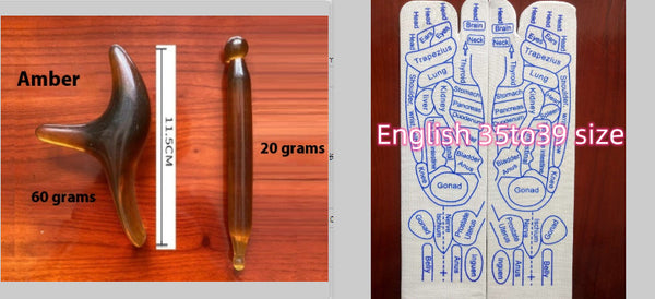 Two wooden tools with measurements and a chart on a wooden surface