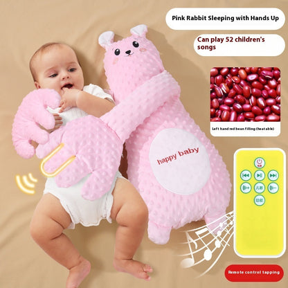 Baby holding a pink rabbit-shaped toy with remote control, on a beige background