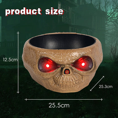 Skull-shaped bowl with glowing red eyes on a dark background, showing product size measurements.