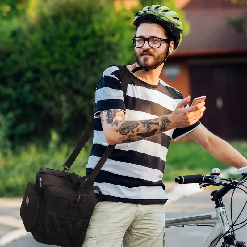 Man carrying black bag