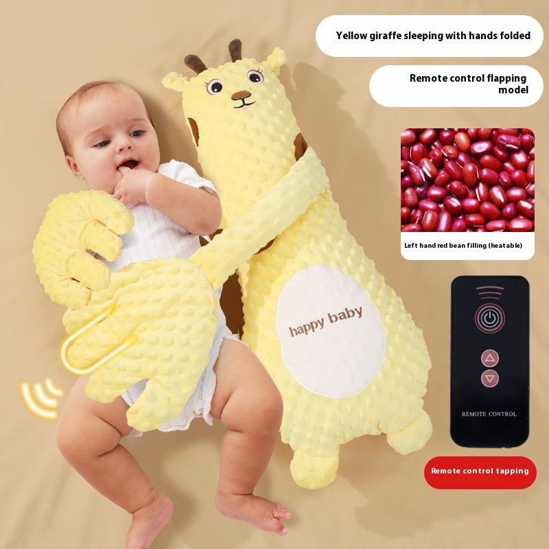 Baby holding a yellow giraffe plush toy with remote control features on a beige background