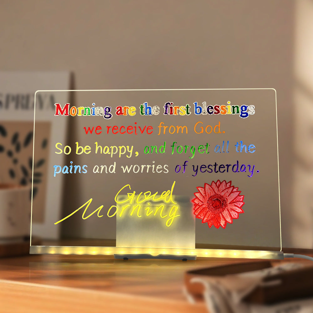 Decorative night light with motivational quote and flower design on a blurred background