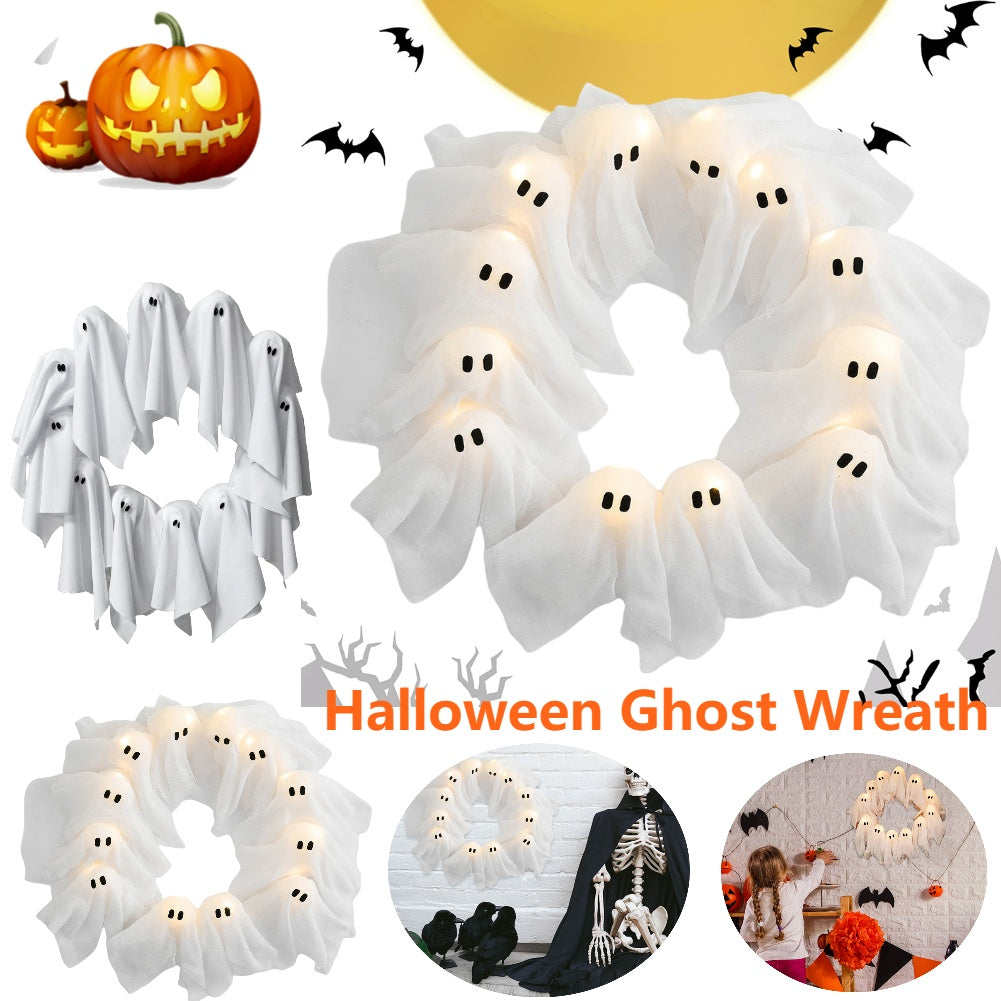 Halloween ghost wreath with lights and pumpkins, bats, and skeletons in the background.