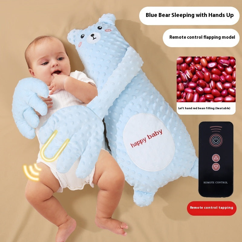 Baby holding a blue bear-shaped toy with remote control, showing puffed beans and remote control details.