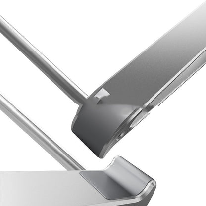 Close-up of a metallic object with a reflective surface on a white background