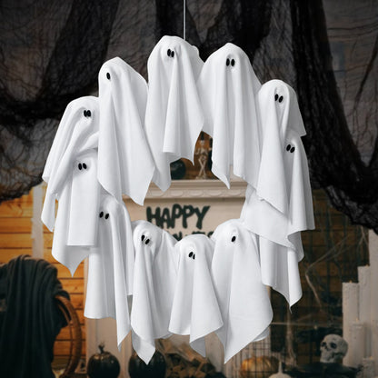 Hanging white ghost decorations against a Halloween-themed background with text.