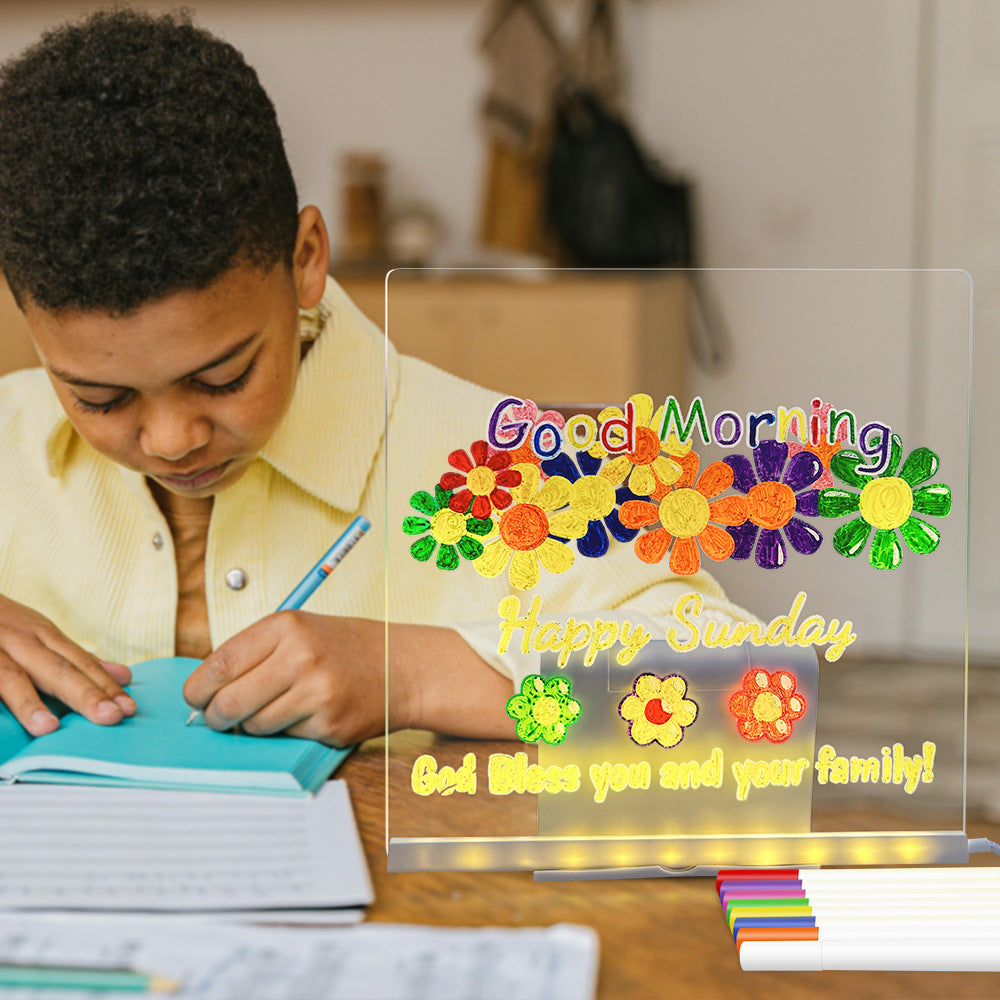 Child writing in a notebook with a decorative card overlay featuring colorful flowers and text.